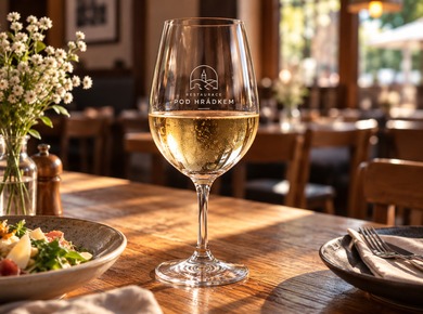 Wine glass featuring a restaurant logo as part of table service